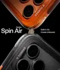 Two phone cases are shown, one orange and one black, with a small rock between them to demonstrate protection. Produktbild-Vorschau