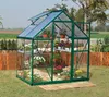 A greenhouse filled with plants in a garden setting. Podgląd zdjęcia produktu