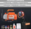 A flat lay image showing a vacuum pump, manifold gauge set, and various accessories, along with a toolkit bag and user manual, all presented against a dark background. Produktbild-Vorschau