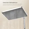 A close-up of a large square shower head with water flowing from it. Náhled obrázku produktu