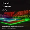 A swimming pool area at night, decorated with colorful LED string lights draped over a hedge and along the edge of the pool. Náhled obrázku produktu