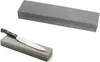 A knife sharpening stone with a knife on it, and another sharpening stone above. Produktbild-Vorschau