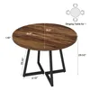 A diagram showing the dimensions of a round dining table with a rustic brown wood top and black metal legs. Podgląd zdjęcia produktu