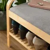 A close-up view of a shoe rack with shoes on the shelves. Produktbild-Vorschau