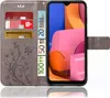 A flip case for a smartphone, showing the inside with credit cards and euro banknotes, and the phone screen displaying a colorful abstract image. Produktbild-Vorschau