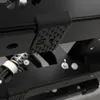 A close-up view of a black pedal with a textured surface and a silver spring mechanism. Produktbild-Vorschau