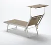A studio shot of a beach lounger with a sunshade. Produktbild-Vorschau