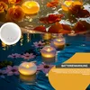 A collage of images showing floating LED candles in water with flowers and rose petals. Produktbild-Vorschau