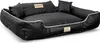 A black dog bed with white trim and two small pillows, shown from a slightly elevated side angle on a white background. Anteprima dell’immagine prodotto
