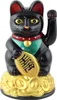 A black lucky cat figurine sitting on a pile of gold coins. Produktbild-Vorschau