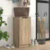 An entryway scene with a shoe cabinet, handbag, umbrellas, and slippers. Anteprima dell’immagine prodotto