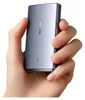 A hand holding a small electronic device. Náhľad obrázku produktu