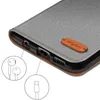 A close-up view of the bottom edge of a phone case, showing ports and a brand logo. Podgląd zdjęcia produktu
