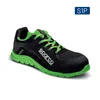 A studio shot of a black and green safety shoe. Produktbild-Vorschau