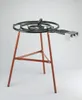 A paella burner stand with a coiled burner on top, set against a plain white background. Voir les images du produit