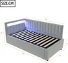 A light gray upholstered bed frame with a slatted mattress base and LED lighting. Produktbild-Vorschau