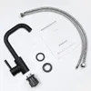 A black faucet and its installation accessories are laid out on a white background, with an instruction manual. Podgląd zdjęcia produktu