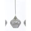 A close-up of a pendant light with a smoky glass shade. Produktbild-Vorschau