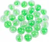A collection of green and white glass marbles. Produktbild-Vorschau