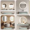 Collage of four different bathroom and vanity settings featuring round LED mirrors. Produktbild-Vorschau