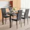 A dining set with four chairs around a table in a modern dining room. Voir les images du produit