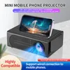 A mini mobile phone projector is shown with a smartphone displaying a movie on its screen. Produktbild-Vorschau