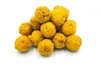 A pile of yellow, round treats on a white background. Voir les images du produit