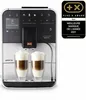 A Melitta Caffeo Barista T Smart coffee machine with two cups of coffee in the foreground. Produktbild-Vorschau