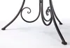 Close-up of the decorative metal legs of a garden table. Produktbild-Vorschau