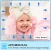 A baby wearing a towel on its head is shown in a mirror with water droplets on it. Arrows indicate airflow and a 'Defog-Bereich' label points to a section of the mirror. Produktbild-Vorschau