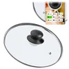 A glass lid for a pot or pan, with a size chart overlay. Voir les images du produit