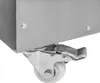 A close-up of a metal caster wheel with a brake mechanism attached to the bottom of a silver-colored appliance. Podgląd zdjęcia produktu