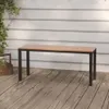 A wooden bench on a wooden deck with a white wall in the background. Produktbild-Vorschau