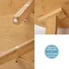 Collage of close-up images showing the construction details of a wooden table, with a marketing badge in the bottom right. Voir les images du produit