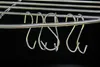A close-up shot of metal hooks hanging from a rack. Podgląd zdjęcia produktu