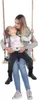 A mother and daughter are sitting on a wooden swing. Náhľad obrázku produktu