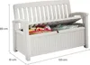 A white storage bench with its lid open, revealing items inside. Dimensions are indicated by lines and text. Náhľad obrázku produktu