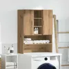 A wooden cabinet for laundry products is shown above a washing machine. Náhled obrázku produktu