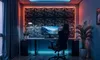 A modern gaming room setup with a desk, chair, computer, and decorative wall panels. Produktbild-Vorschau