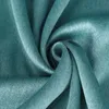 A close-up view of teal-colored fabric, folded and swirled. Voir les images du produit