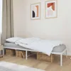 A bedroom scene with a white metal bed frame, white bedding, and two framed abstract art pieces on the wall. Produktbild-Vorschau