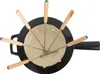A top-down view of a black cast iron fondue pot with eight fondue forks radiating outwards, each with a different colored wooden handle. Podgląd zdjęcia produktu