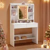 A white vanity table with a lighted mirror, decorated for Christmas with trees and lights. Produktbild-Vorschau