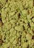 A close-up, textured view of a pile of green powder. Produktbild-Vorschau