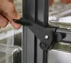 A hand is shown operating a latch on a greenhouse door. Produktbild-Vorschau