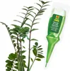 A plant with a plant food applicator next to it. Produktbild-Vorschau