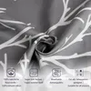 A close-up of grey fabric with a white tree branch pattern, featuring informational icons and text at the bottom. Produktbild-Vorschau