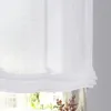 A close-up view of a white linen Roman blind hanging in front of a window. Produktbild-Vorschau