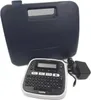 A Brother P-touch D200BWVP label maker with its carrying case and power adapter. Produktbild-Vorschau