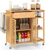 A wooden kitchen cart filled with various items like bottles, juice boxes, and dishes. Podgląd zdjęcia produktu
